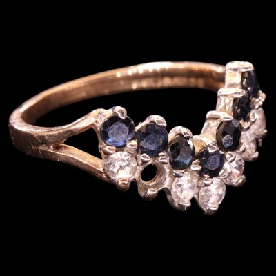 Lot 1480 - A 1980s sapphire and white gemstone chevron...