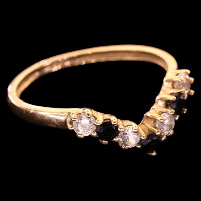 Lot 1481 - A vintage dark blue gemstone and cubic...
