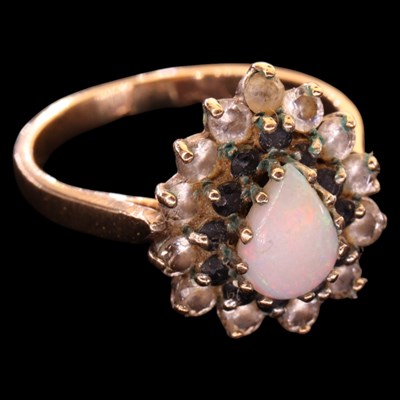 Lot 1483 - A 1980s opal, blue and white gemstone cluster...