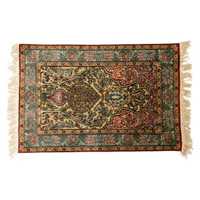 Lot 1657 - A Persian silk prayer mat, decorated with...