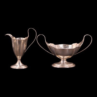 Lot 1199 - An Edwardian silver two-handled sugar bowl and...