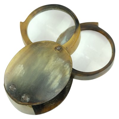 Lot 630 - A 19th Century horn pocket two-lens magnifying...