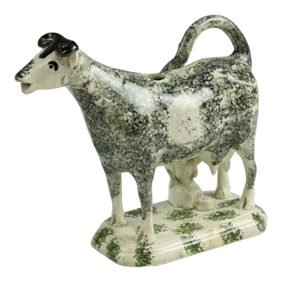 Lot 970 - A 19th Century spongeware cow creamer,...