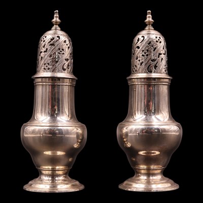 Lot 1216 - A pair of George II silver pepperettes, each...