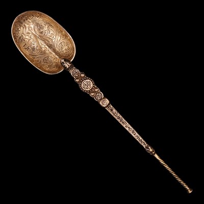 Lot 1225 - A 1930s silver gilt anointing spoon, modelled...