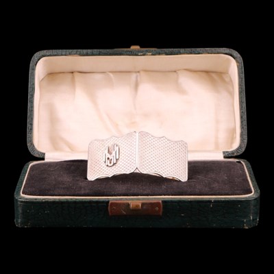 Lot 1234 - A cased Art Deco silver napkin ring, of...