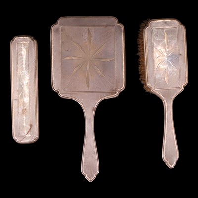 Lot 1259 - An Art Deco silver three-piece dressing table...