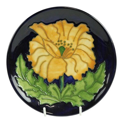 Lot 869 - A Moorcroft pottery small plate, decorated...