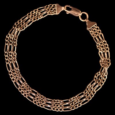 Lot 1410 - A vintage 9 ct gold triple figaro-link...