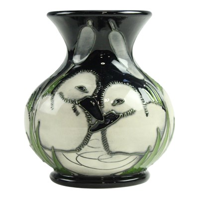 Lot 882 - A Moorcroft "Cygnets" small baluster...