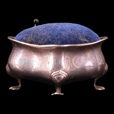 Lot 1193 - An Edwardian silver pin cushion, of quatrefoil-...
