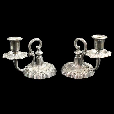 Lot 1291 - A pair of electroplate piano candlesticks, 13 cm