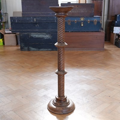 Lot 1667 - A late 20th Century oak torchiere or stand,...