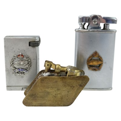 Lot 167 - Three Royal Tank Corps cigarette lighters, one...