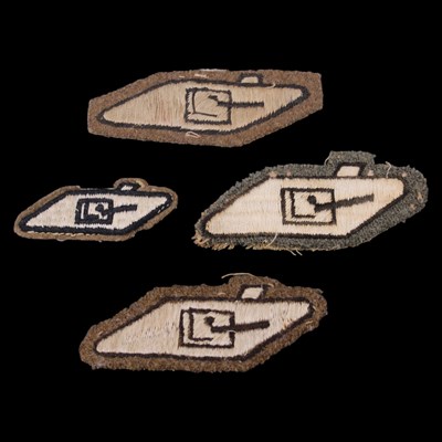 Lot 129 - Four Royal Tank Regiment cloth arm badges
