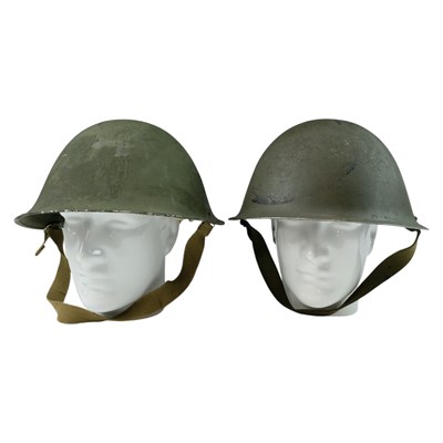 Lot 296 - Two 1950s British Army Mk IV steel helmets