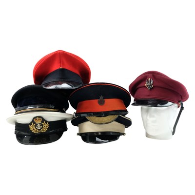 Lot 294 - A quantity of post-War British military peaked...