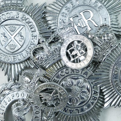 Lot 713 - A group of George VI and QEII police helmet...