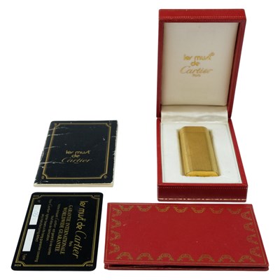 Lot 670 - A Must de Cartier gold-plated lighter, boxed...