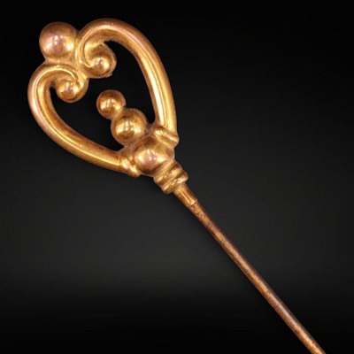 Lot 1246 - A late Victorian hat pin, having a 9 ct gold...