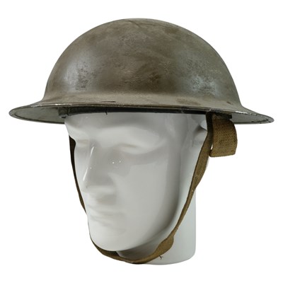 Lot 300 - A Second World War British Mk 2 steel helmet,...
