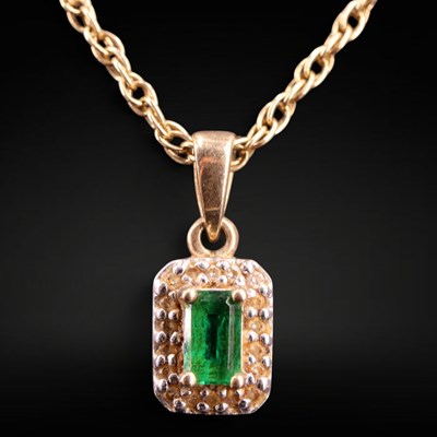 Lot 1265 - A near-contemporary emerald and diamond...