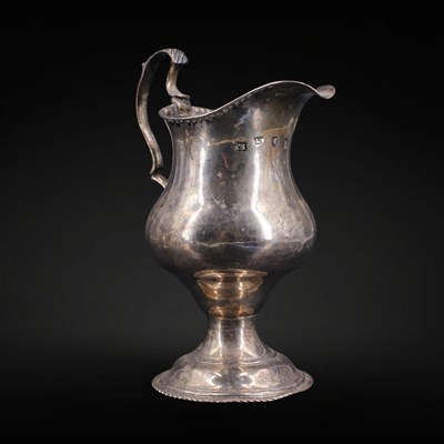 Lot 1159 - A George III silver helmet form cream jug,...