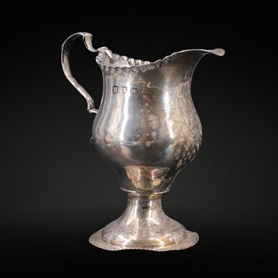 Lot 1160 - A George III silver helmet-form cream jug,...