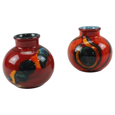 Lot 958 - A Poole Pottery "Volcano" bud vase, together...