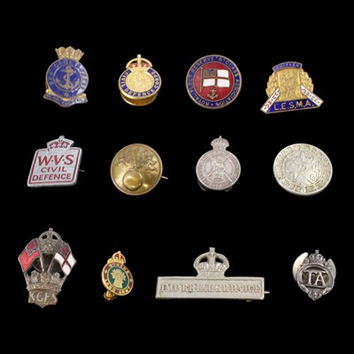 Lot 144 - A small collection of military and British...