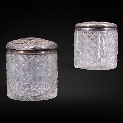 Lot 1176 - An Edwardian silver-lidded cut-glass dressing...