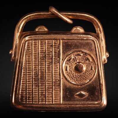 Lot 1273 - A 1970s 9 ct gold vintage radio charm or...