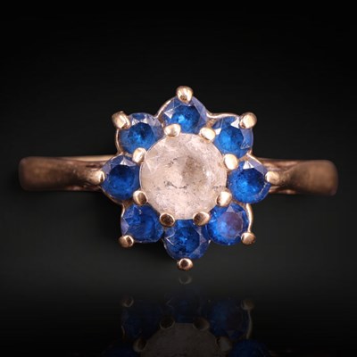Lot 1280 - A 1970s blue and white gemstone flowerhead...