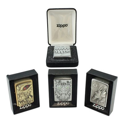 Lot 552 - Four boxed Zippo lighters, comprising "Dragon...