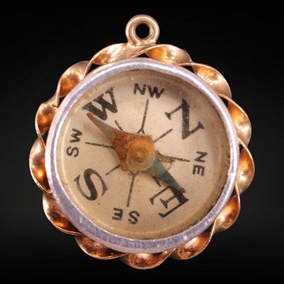 Lot 1334 - A 1970s  9 ct gold fob magnetic compass, the...