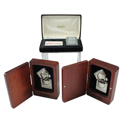 Lot 553 - Three boxed Zippo lighters, comprising "Dragon...