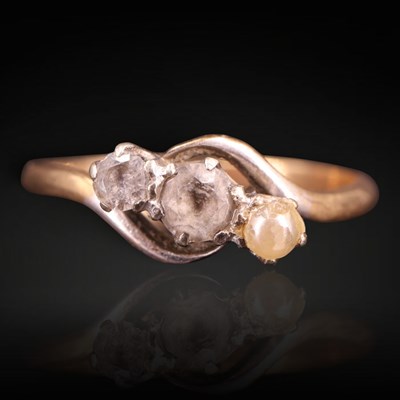 Lot 1293 - A vintage white sapphire and pearl three-stone...