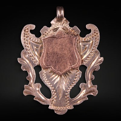 Lot 1336 - A George V silver shield-shaped fob...