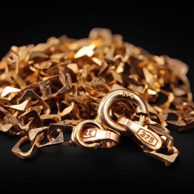 Lot 1296 - A 1990s Italian 9 ct gold flattened curb-link...
