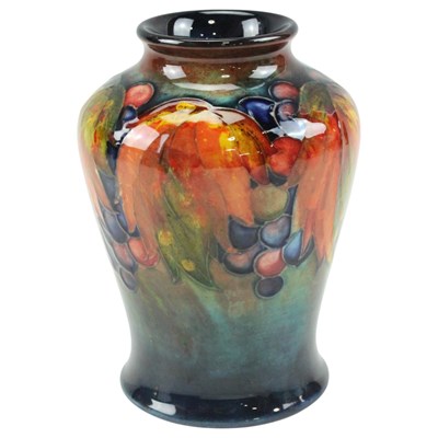 Lot 952 - A boxed Moorcroft "Leaf and Berry" vase, of...