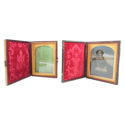 Lot 657 - A cased tinted Daguerreotype portrait of a...
