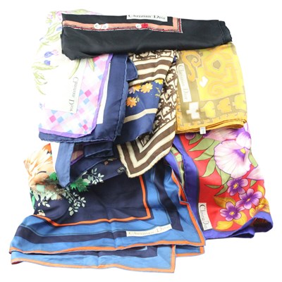 Lot 812 - Eight Christian Dior printed silk scarves,...