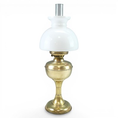 Lot 860 - A brass oil lamp, having a funnel and milk...