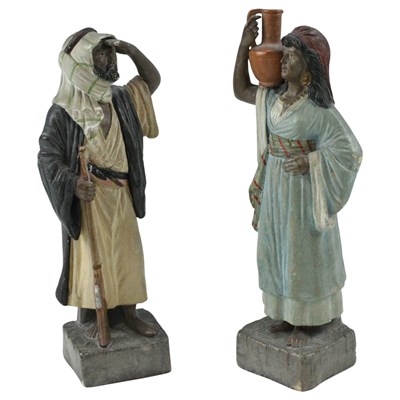 Lot 915 - A pair of Austrian painted terracotta figures...