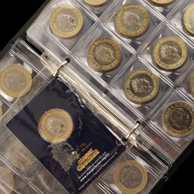 Lot 475 - A folder of approximately twenty eight £2 coins