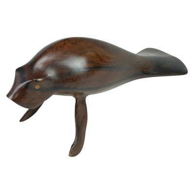 Lot 862 - A carved hardwood sculpture of a sea cow or...