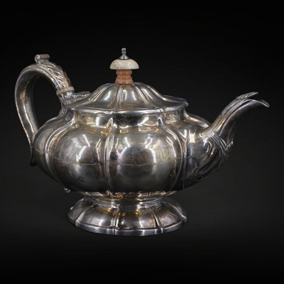 Lot 1115 - A George IV silver teapot, of compressed melon-...