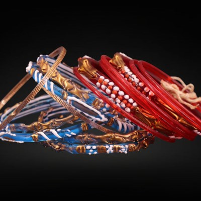 Lot 1261 - A collection of vintage Kashmiri glass bangles