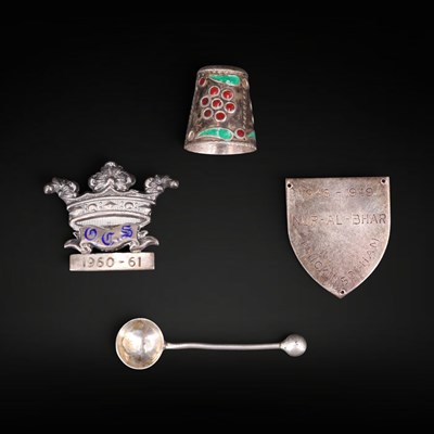 Lot 1137 - An enamelled silver badge, plaque, and salt...