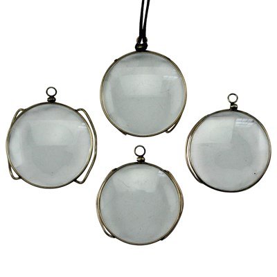 Lot 655 - Four gold-plated monocles, early 20th Century